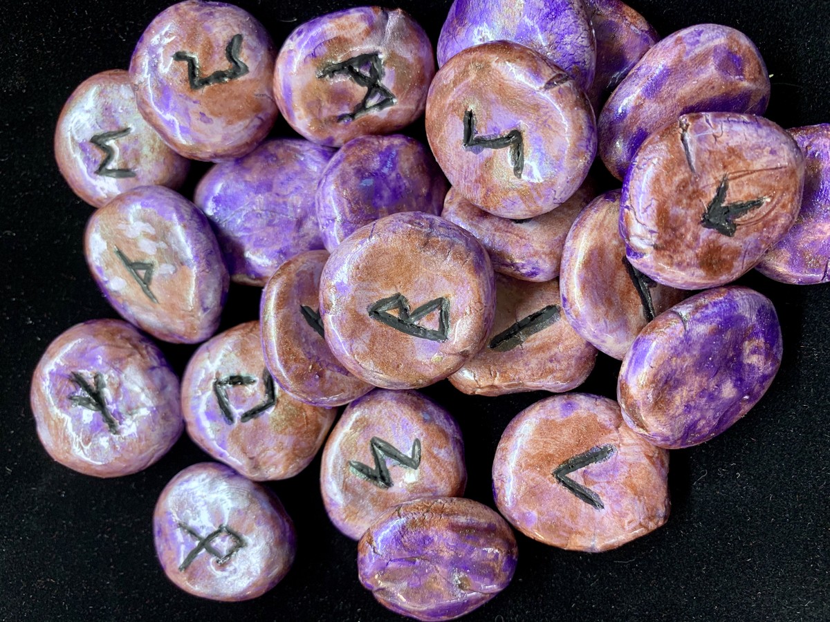 Purple marbled rune stones on velvet