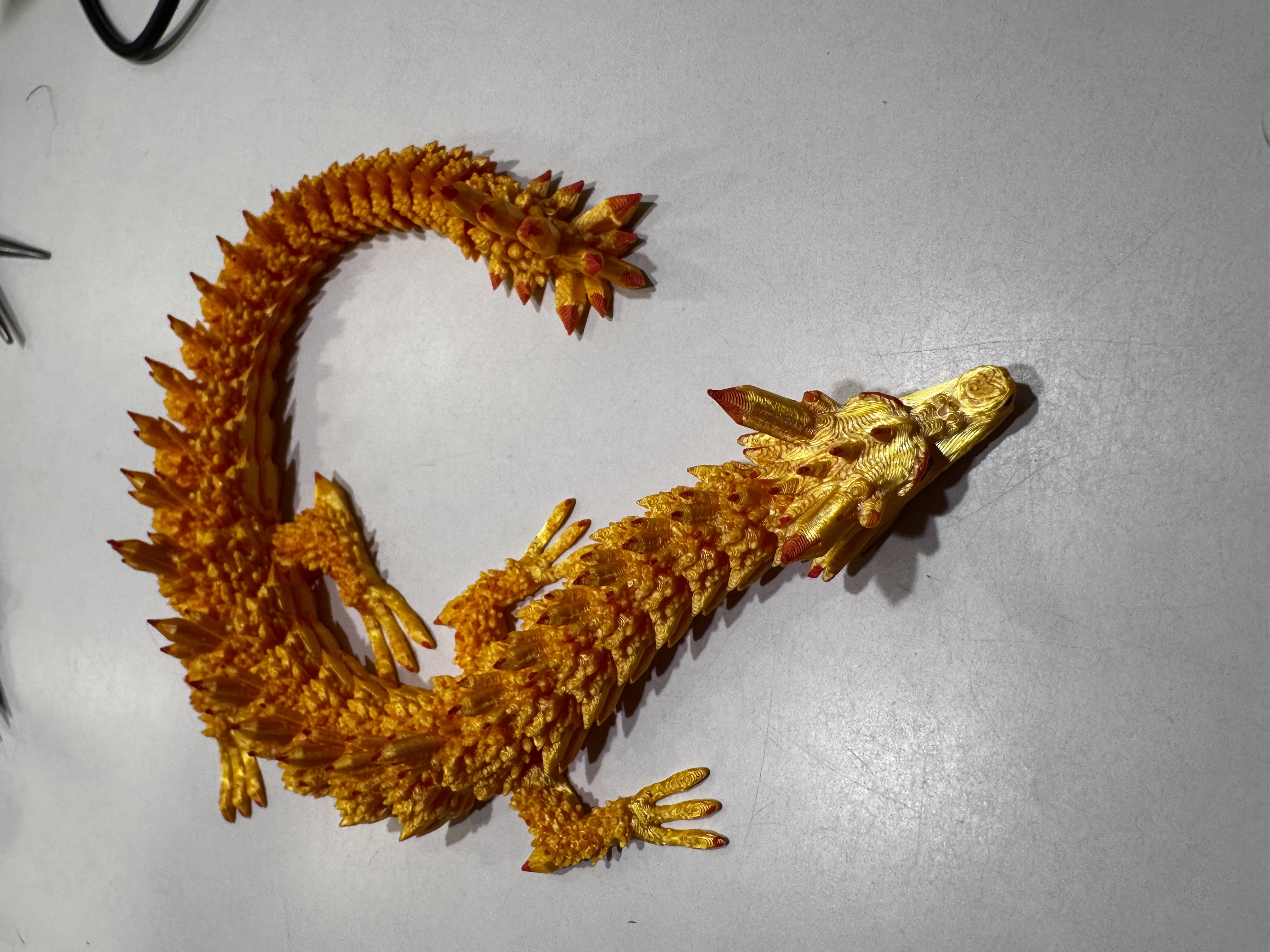 Gold dragon detail showing painted spine tips