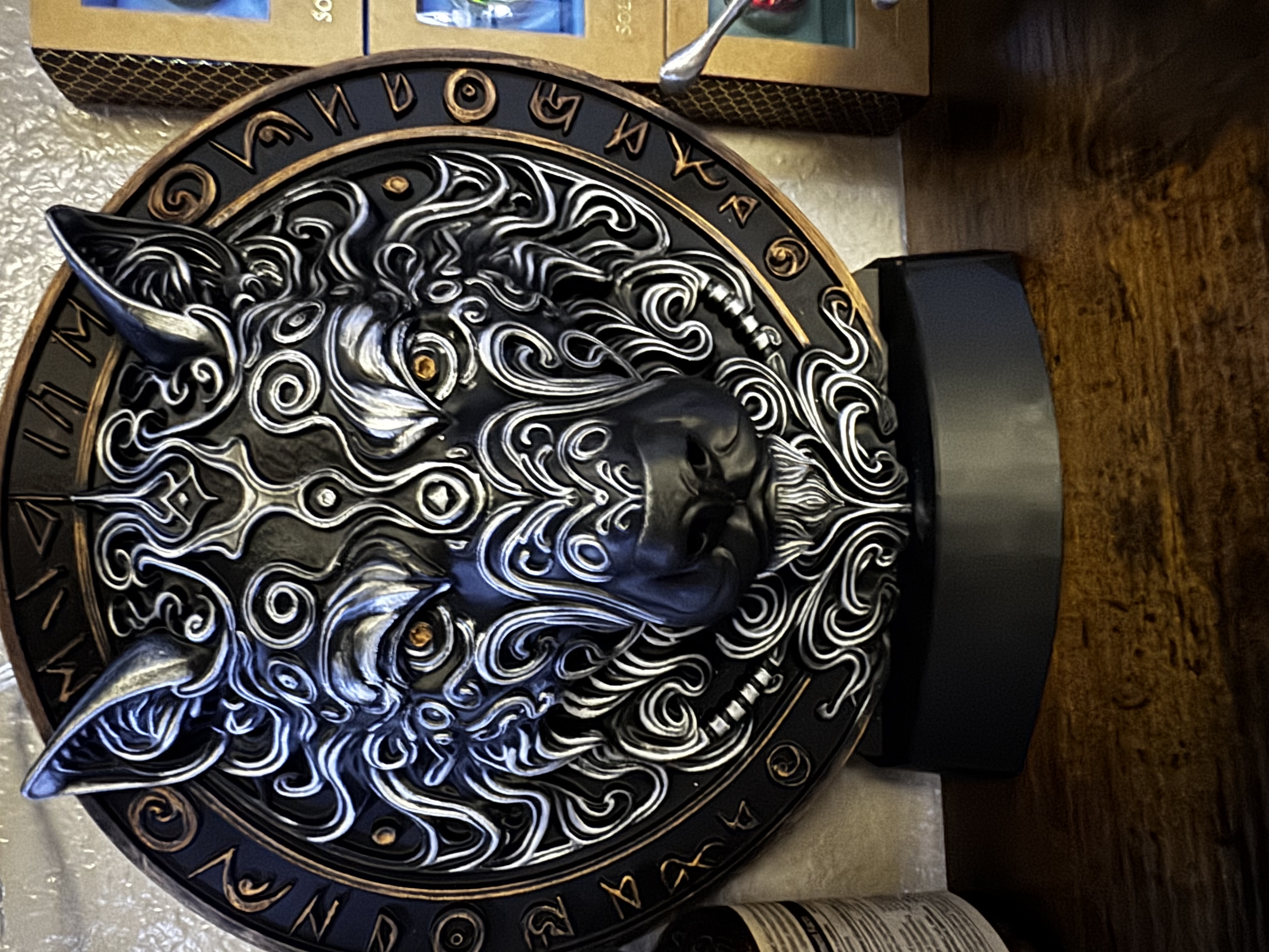 Fenrir wolf plaque in black and silver with a ring of Norse runes